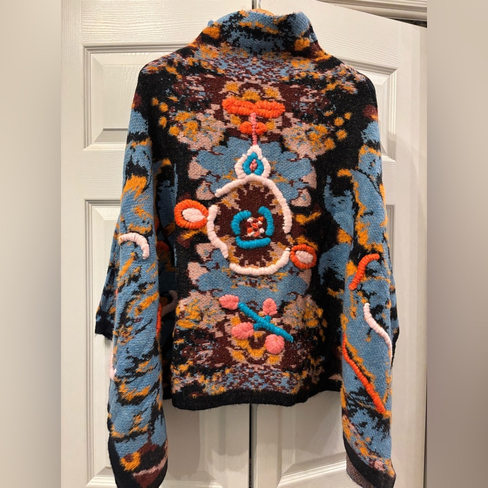 Zara textured embroidered poncho sweater.